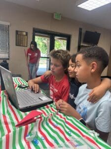 RASCALS students in front of laptop